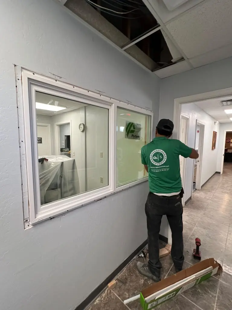 Sentia Renovation team member installing an interior window
